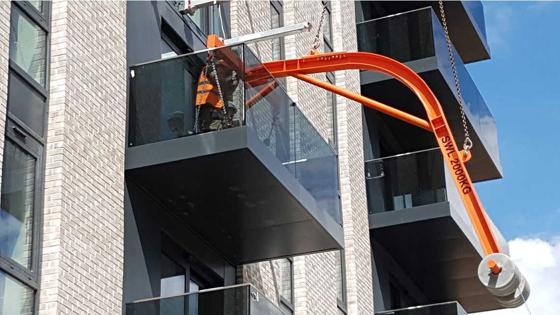 A balcony being fitted and the cantilever arms ready in position at the next level A balcony being fitted and the cantilever arms ready in position at the next level