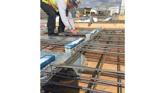 Isokorb® Type CM installed on balcony with in-slab ducts at installer training session